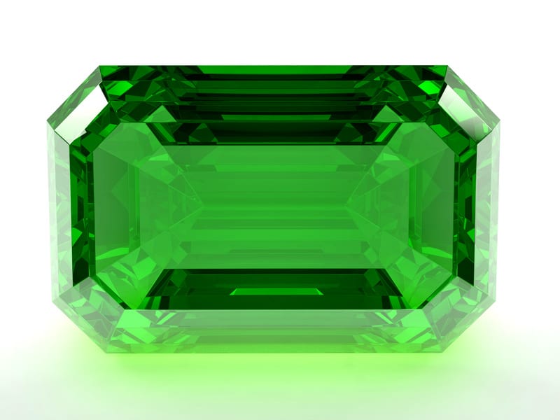 A cut emerald set in a piece of jewelry