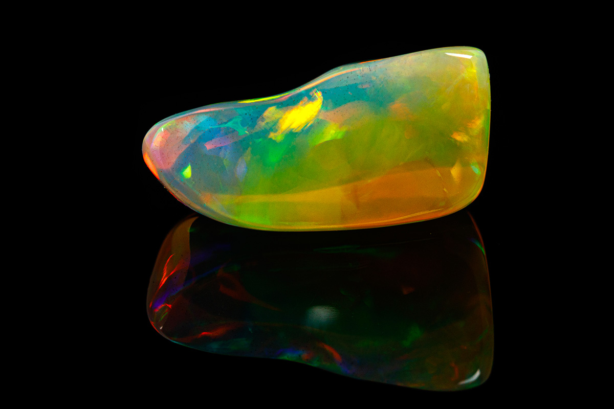 Multicolored opal on a black background